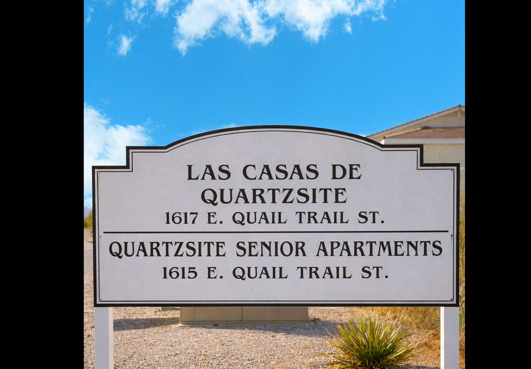 This image displays entrance marker photo of Quartzsite Senior Apartments